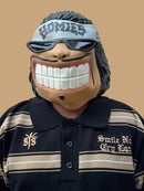 Polo tejida “Sonríe ahora” caramelo negro/caqui