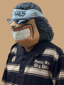 Polo tejida “Sonríe ahora” caramelo negro/caqui